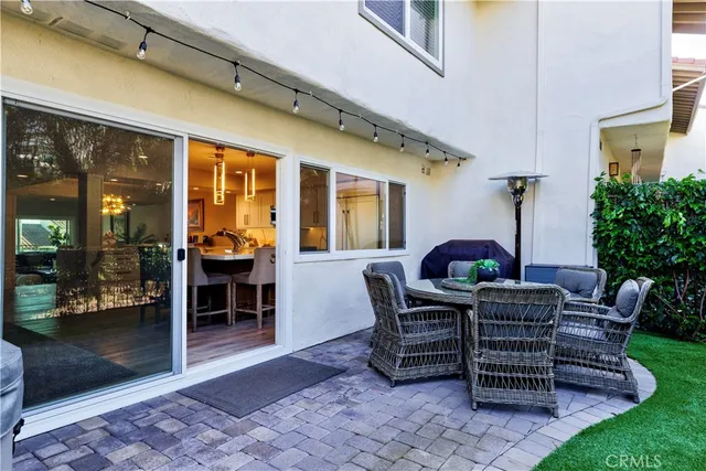 a view of outdoor dining space with a patio