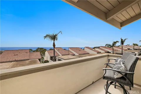a view of a dining room with furniture and a potted plant