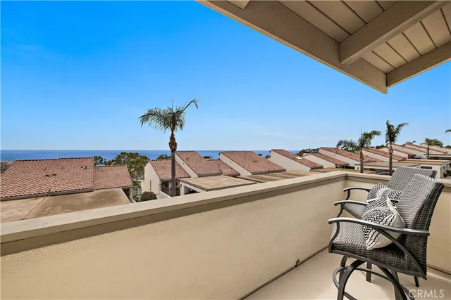 a view of a dining room with furniture and a potted plant