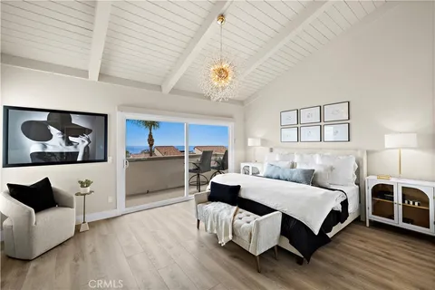 a spacious bedroom with a bed and a couch