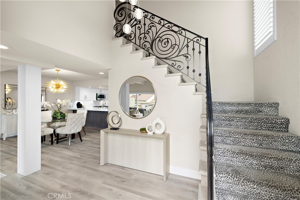 23277 Atlantis Way Dana Point, CA 92629 - Photo 6 of 48 a living room with furniture and a wooden floor