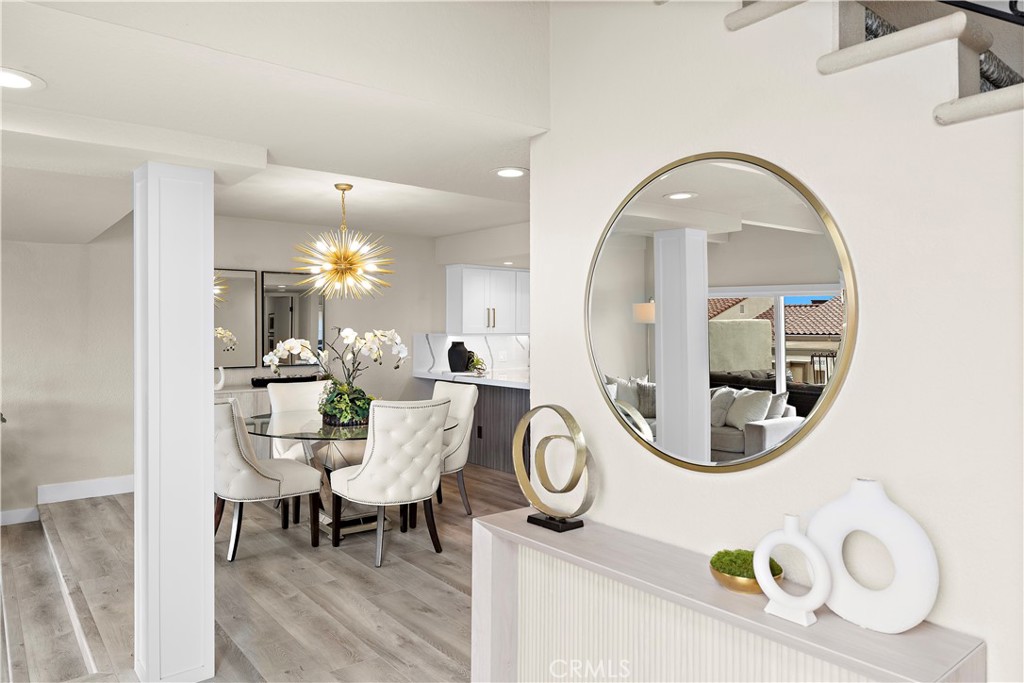 23277 Atlantis Way Dana Point, CA 92629 - Photo 7 of 48 a view of a dining room with furniture and chandelier