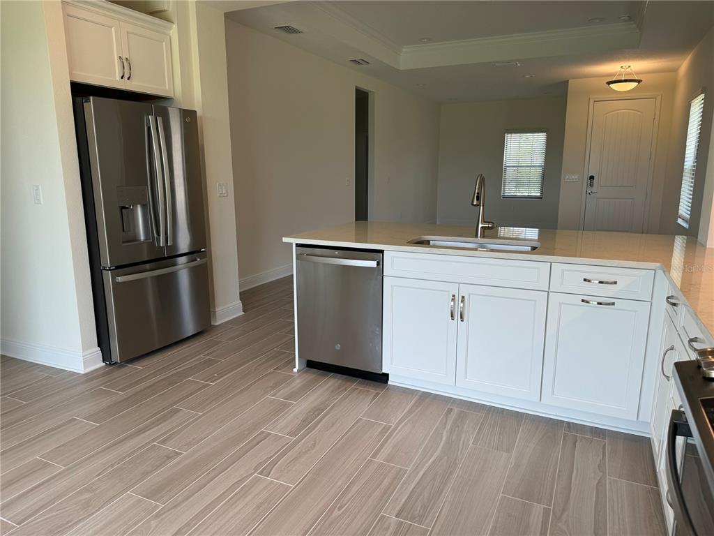261 Potenza Loop Nokomis, FL 34275 - Photo 12 of 42 a kitchen with a refrigerator stove and sink