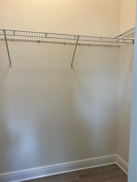 261 Potenza Loop Nokomis, FL 34275 - Photo 15 of 42 a view of a room with racks on the wall