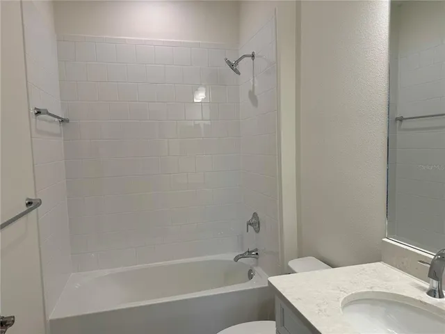 a bathroom with a sink and a bathtub
