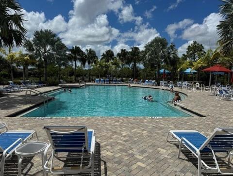 261 Potenza Loop Nokomis, FL 34275 - Photo 27 of 42 a view of a lake with a table and chairs