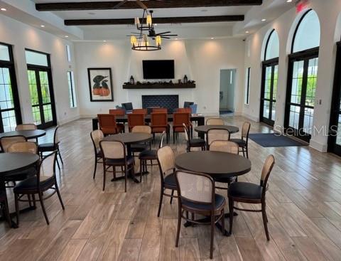 261 Potenza Loop Nokomis, FL 34275 - Photo 30 of 42 a view of a dining room with furniture a chandelier and wooden floor