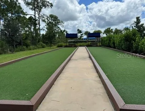 a view of swimming pool with a yard