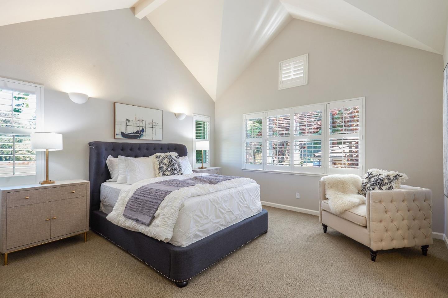 600 Willow Road, Unit 24 Menlo Park, CA 94025 - Photo 14 of 23 a spacious bedroom with a bed and a couch