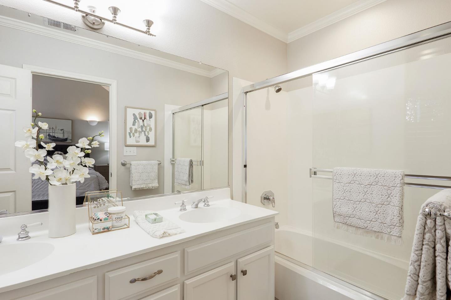 600 Willow Road, Unit 24 Menlo Park, CA 94025 - Photo 17 of 23 a bathroom with a tub sink and mirror