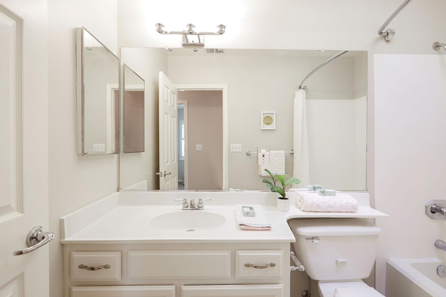 600 Willow Road, Unit 24 Menlo Park, CA 94025 - Photo 19 of 23 a bathroom with a sink and a mirror