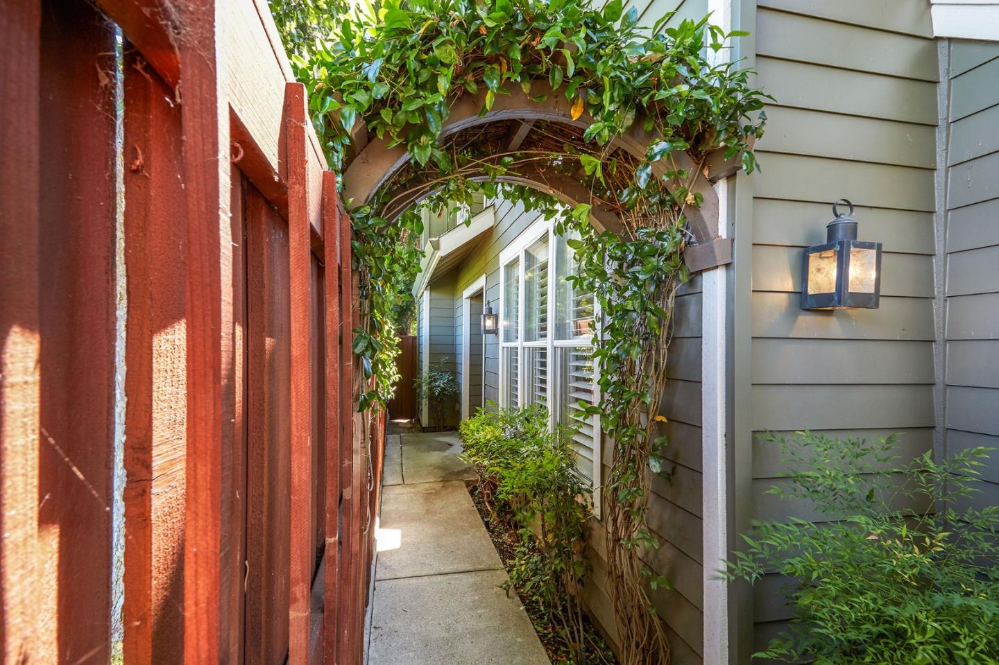 600 Willow Road, Unit 24 Menlo Park, CA 94025 - Photo 2 of 23 a view of a pathway of a house with plants