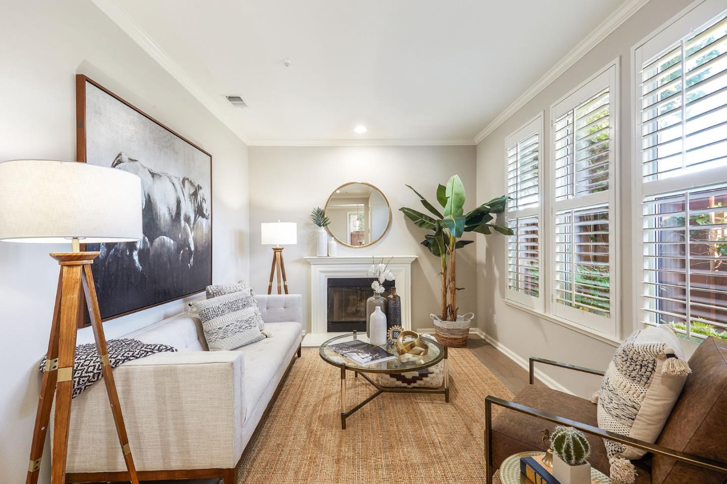 600 Willow Road, Unit 24 Menlo Park, CA 94025 - Photo 6 of 23 a living room with furniture fireplace and a large window