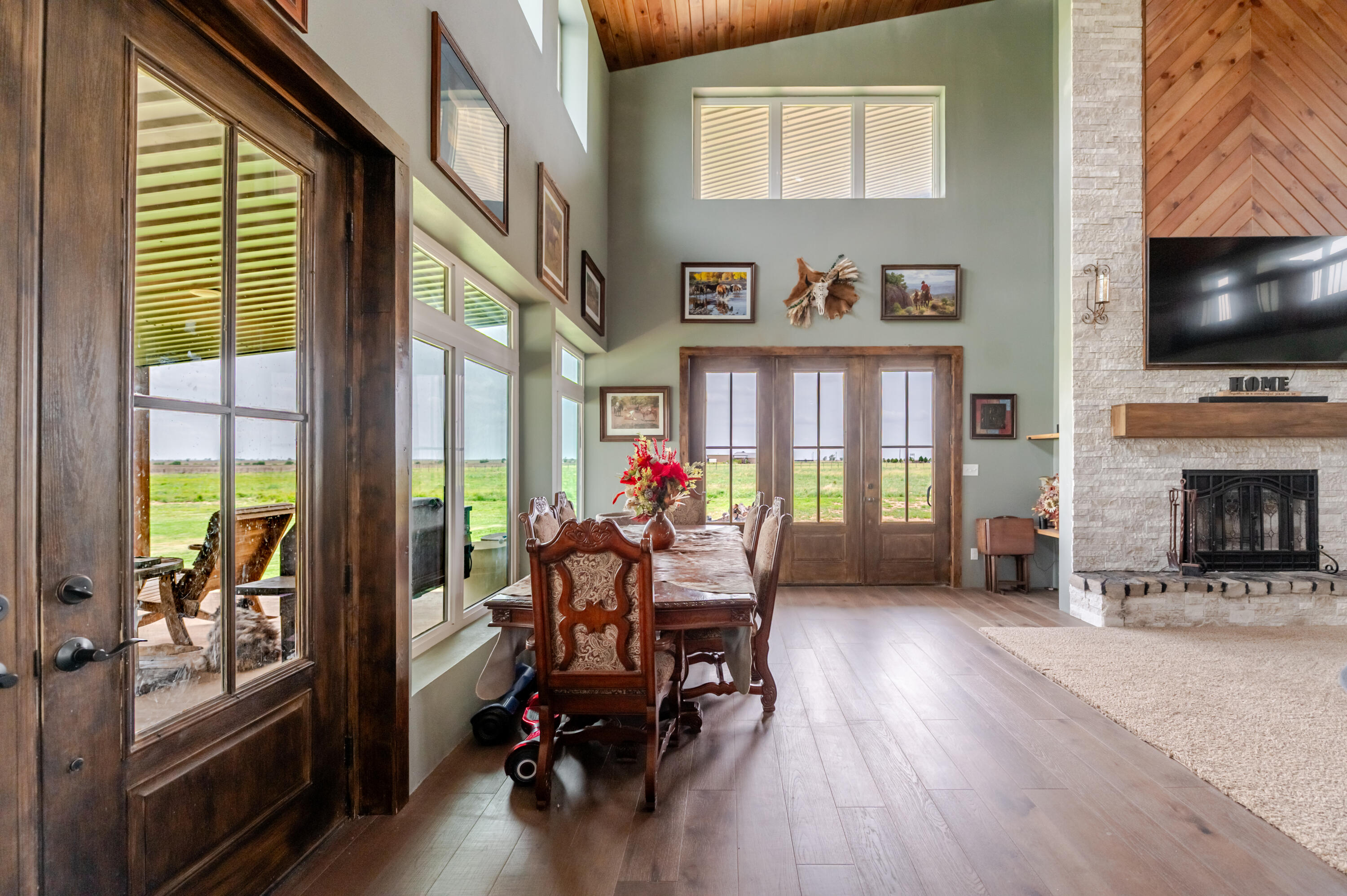 6792 Maine Road Anton, TX 79313 - Photo 31 of 77 a dining room with furniture fire place and a flat screen tv