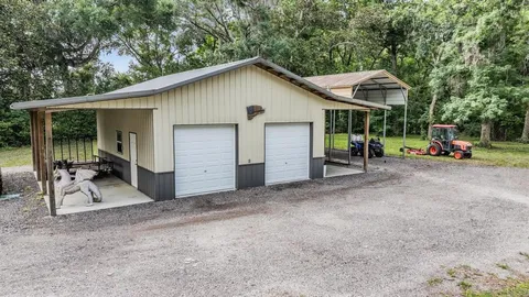 a balcony with furniture and wooden floor