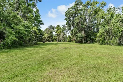 a kitchen with stainless steel appliances kitchen island granite countertop a sink and cabinets