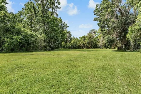 a view of a chairs and table in a balcony