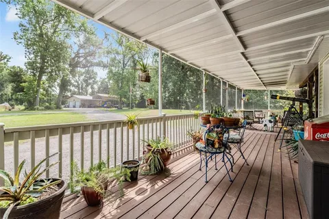 a bedroom with furniture and wooden floor
