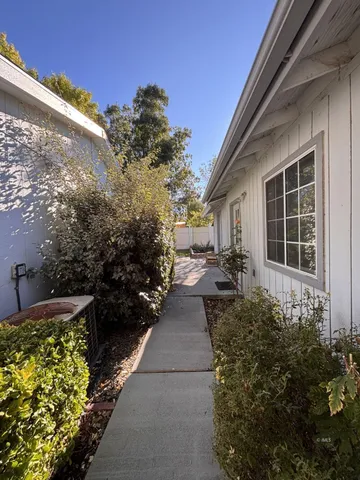 a view of a porch with potted plants