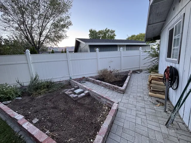 a view of a backyard with chairs