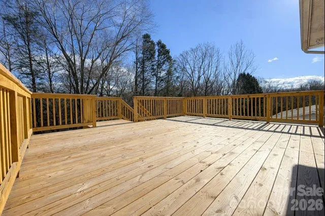 a view of backyard and deck