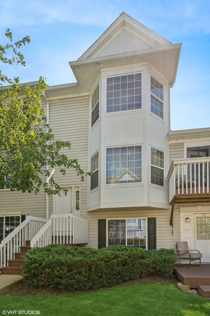 33 South Treehouse Lane Round Lake, IL 60073 - Photo 1 of 10 front view of a house with a yard