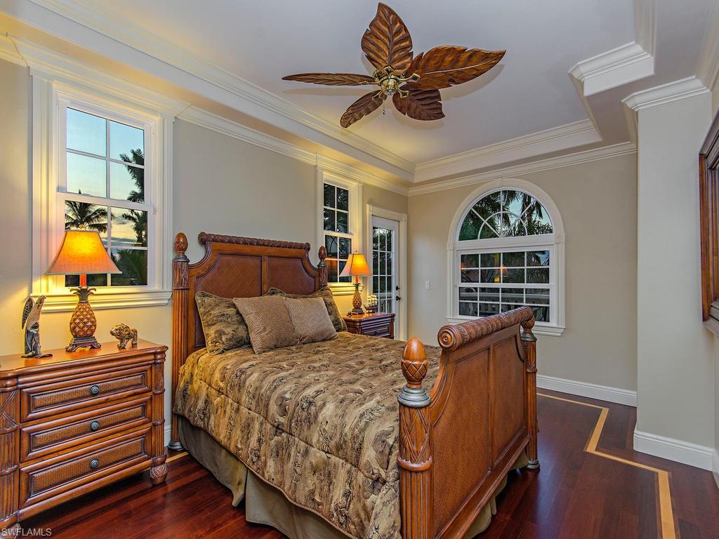 1835 Kingfish Road Naples, FL 34102 - Photo 14 of 23 a bed room with a bed and a window