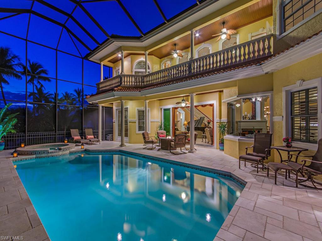 1835 Kingfish Road Naples, FL 34102 - Photo 16 of 23 a view of a swimming pool with outdoor seating