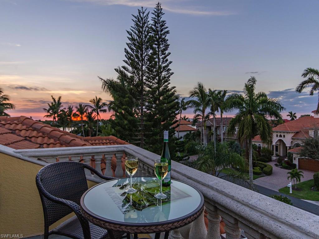 1835 Kingfish Road Naples, FL 34102 - Photo 18 of 23 a view of a chairs and table in patio