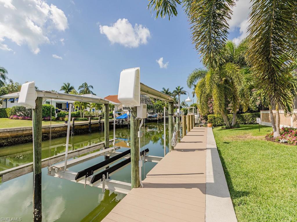 1835 Kingfish Road Naples, FL 34102 - Photo 19 of 23 a front view of a house with a yard