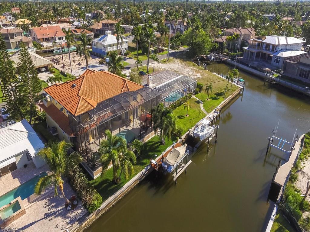 1835 Kingfish Road Naples, FL 34102 - Photo 20 of 23 an aerial view of a house with a lake view