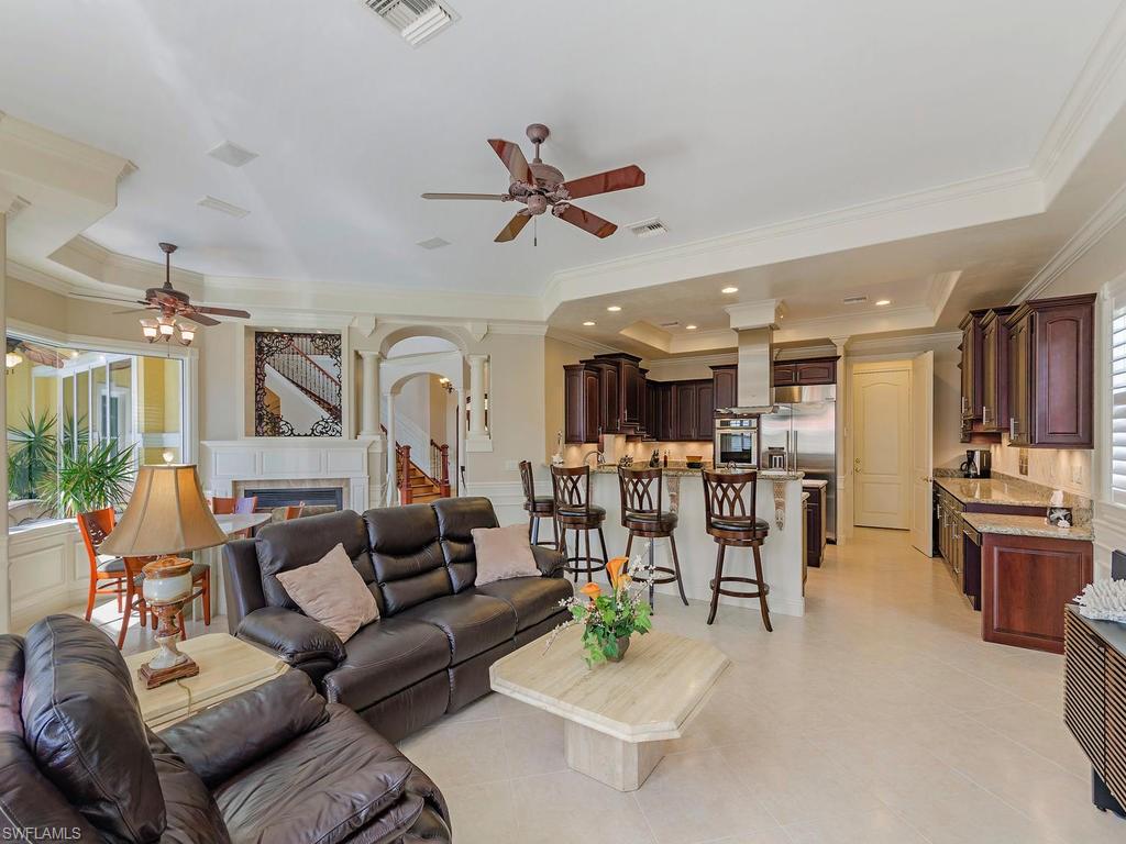 1835 Kingfish Road Naples, FL 34102 - Photo 4 of 23 a living room with furniture and kitchen view