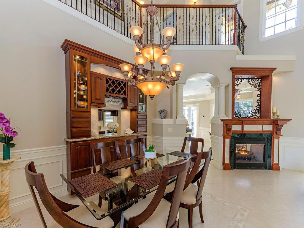 1835 Kingfish Road Naples, FL 34102 - Photo 6 of 23 a view of a dining room with furniture and a chandelier