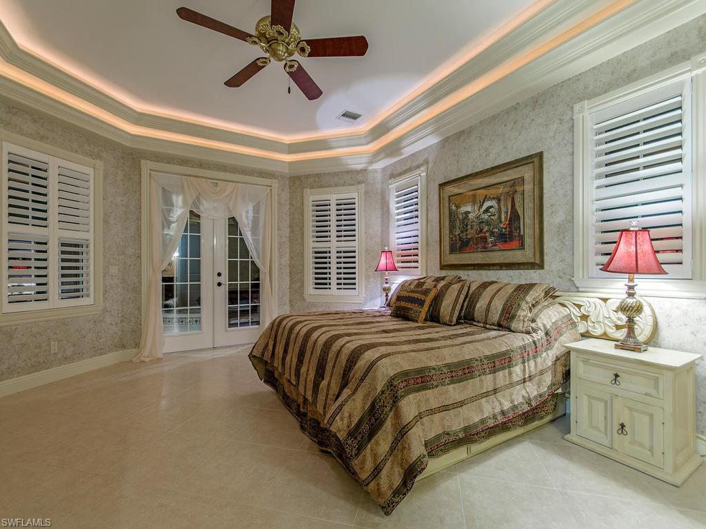 1835 Kingfish Road Naples, FL 34102 - Photo 10 of 23 a bed room with a bed and a window