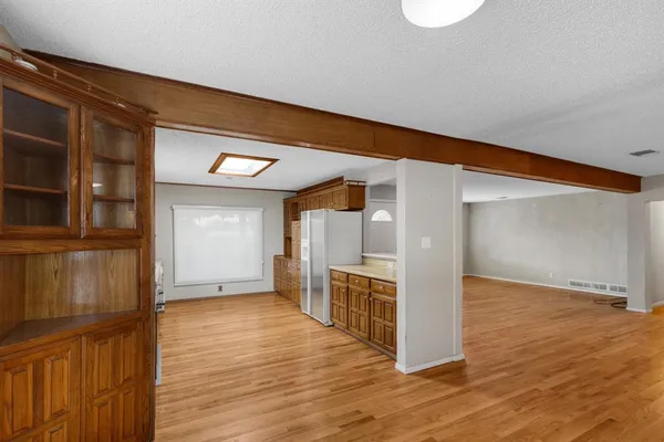 a view of a kitchen cabinets and wooden floor
