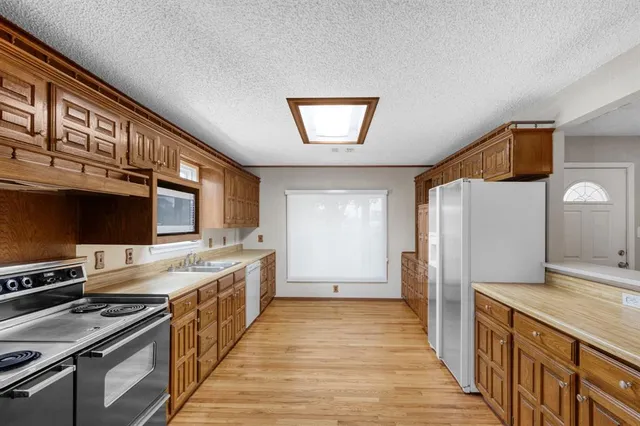 a kitchen with a stove and a refrigerator