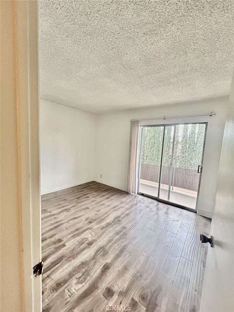 922 West Duarte Road, Unit 3 Arcadia, CA 91007 - Photo 12 of 16 a view of an empty room and wooden floor