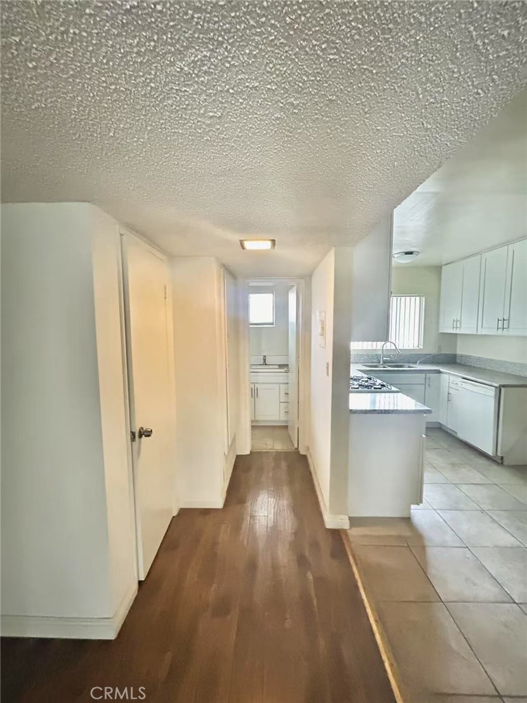 922 West Duarte Road, Unit 3 Arcadia, CA 91007 - Photo 8 of 16 a view of a kitchen with wooden floor and a sink