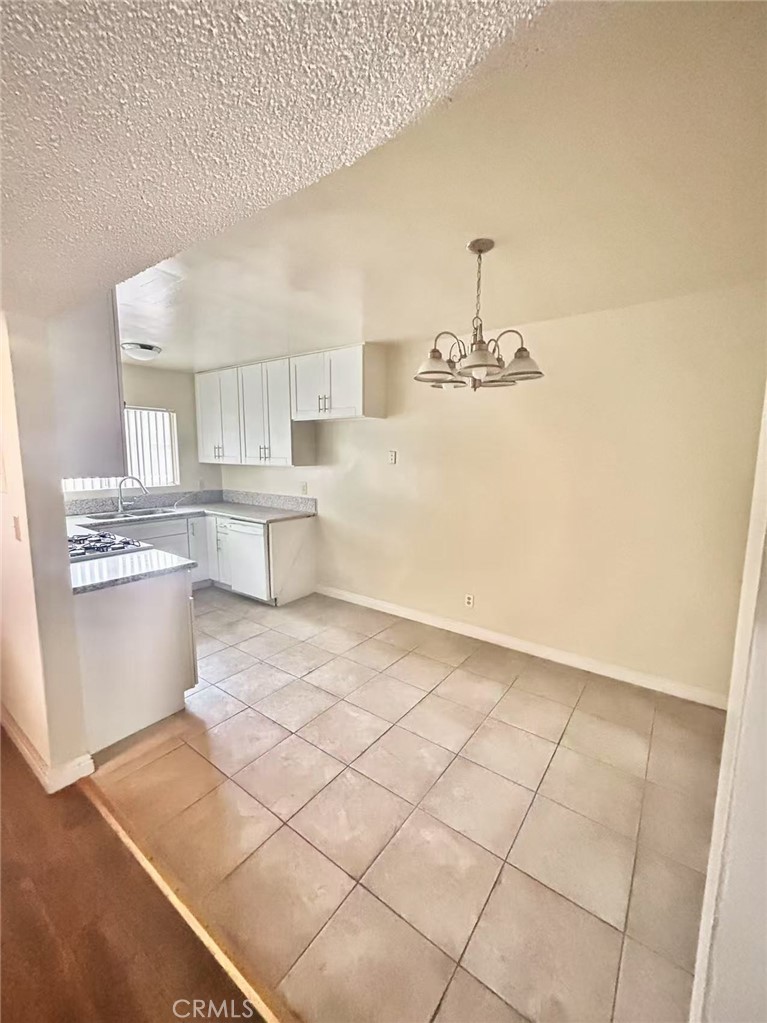 922 West Duarte Road, Unit 3 Arcadia, CA 91007 - Photo 9 of 16 a kitchen with stainless steel appliances a sink and cabinets