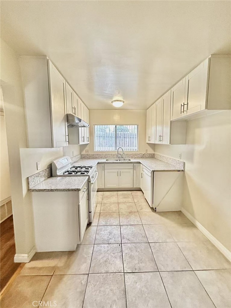 922 West Duarte Road, Unit 3 Arcadia, CA 91007 - Photo 10 of 16 a kitchen with stainless steel appliances granite countertop a sink and cabinets