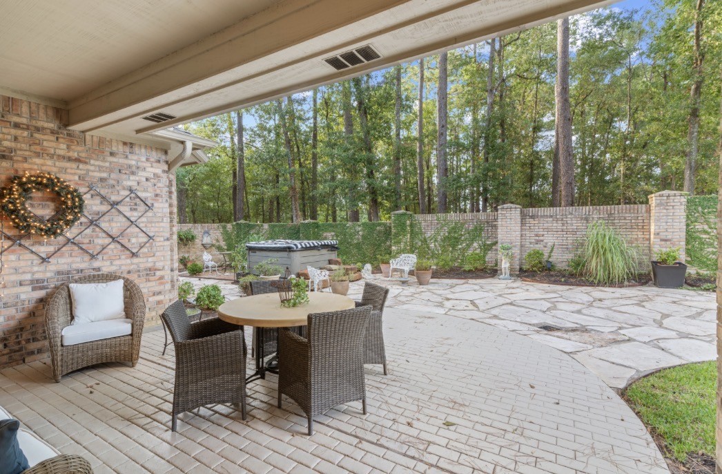 901 Longmire Road, Unit 51 Conroe, TX 77304 - Photo 11 of 48 High styled back patio with Jacuzzi, breathtaking views unlike anything else.