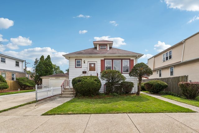 2917 North Rutherford Avenue Chicago, IL 60634 - Photo 1 of 34 a front view of a house with a garden