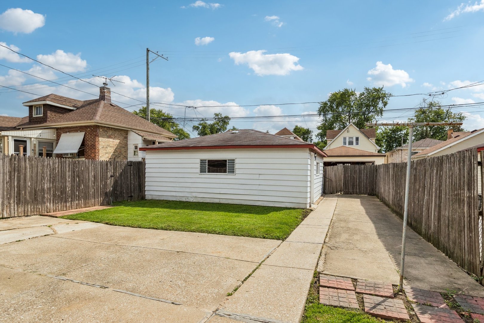 2917 North Rutherford Avenue Chicago, IL 60634 - Photo 28 of 34 a front view of a house with a garden and trees
