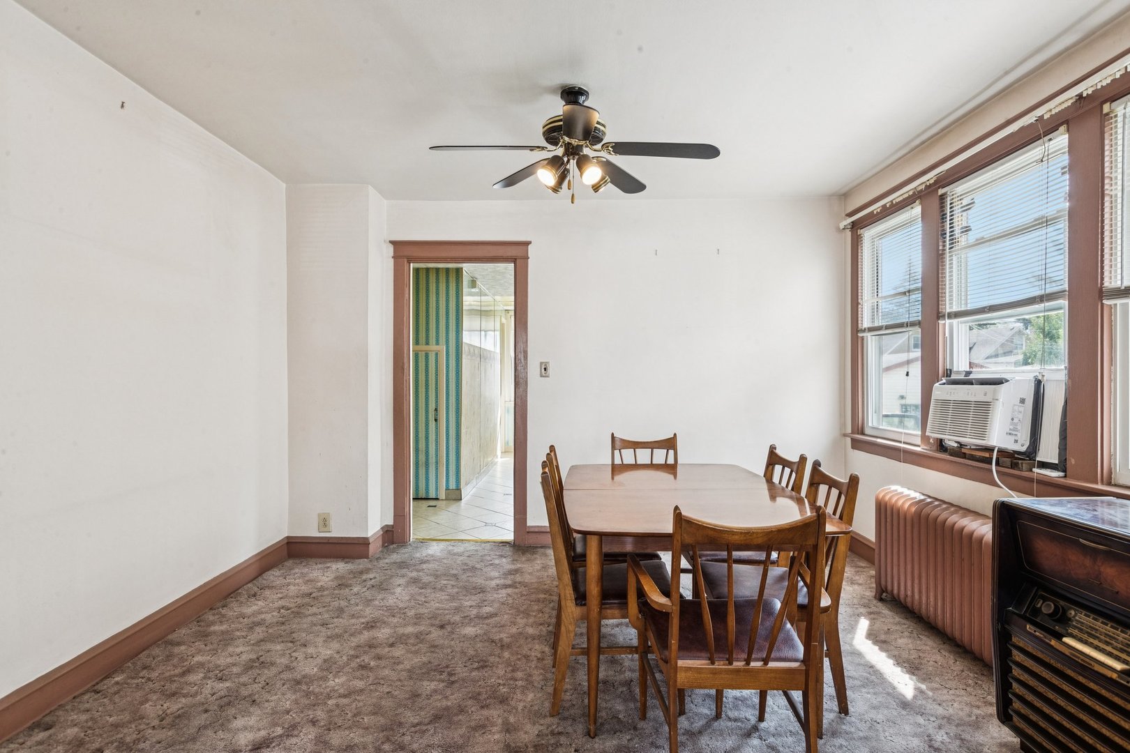 2917 North Rutherford Avenue Chicago, IL 60634 - Photo 6 of 34 a view of a dining room with furniture and a window