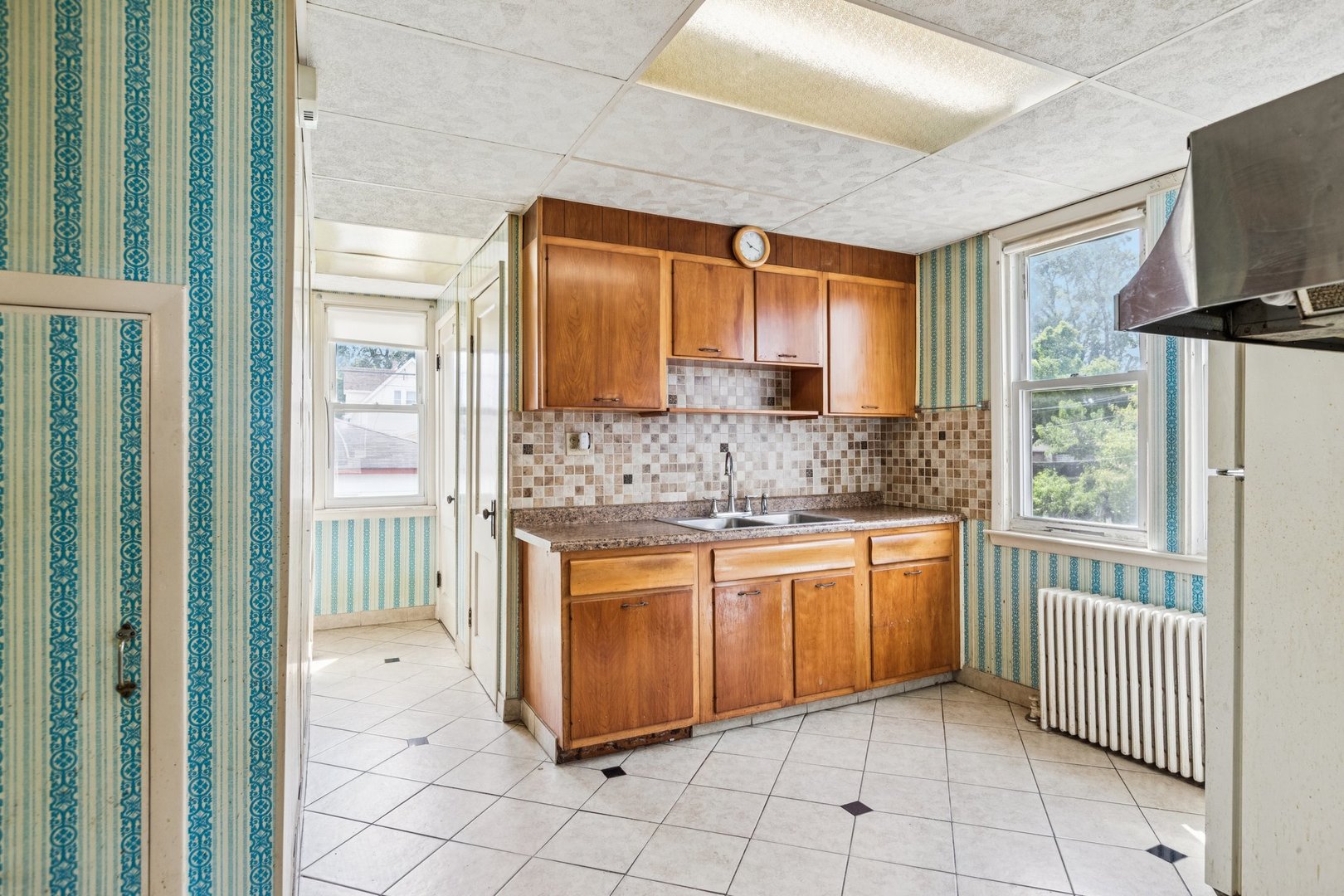 2917 North Rutherford Avenue Chicago, IL 60634 - Photo 8 of 34 a kitchen with stainless steel appliances granite countertop a refrigerator and a sink
