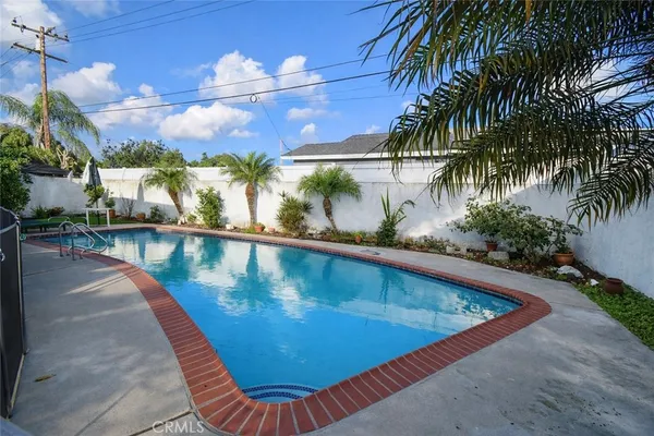 a view of swimming pool with a patio