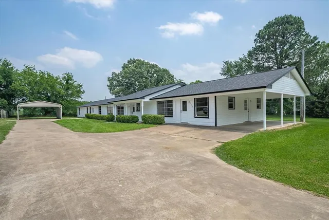 front view of a house with a yard