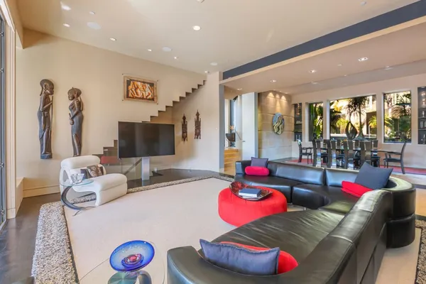 a dining room with furniture and wooden floor
