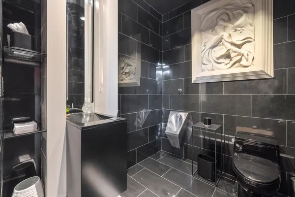 a media room with lots of chairs and a projector screen