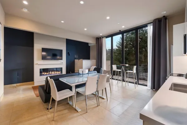 a sign that is sitting on a brick wall